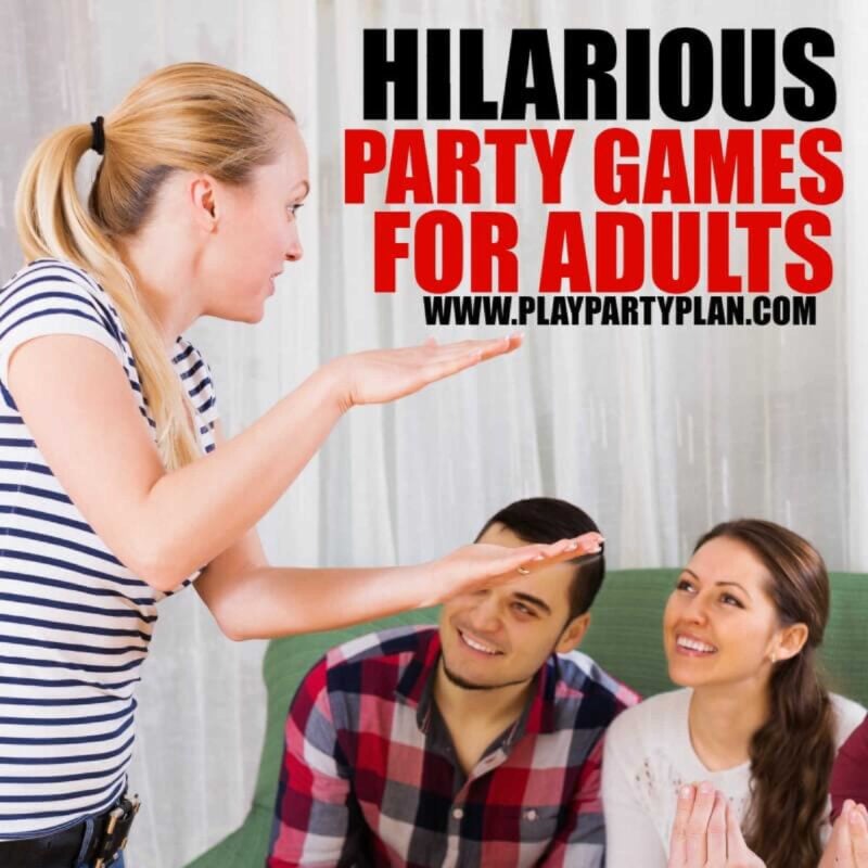 Woman playing charades while team on the couch is guessing
