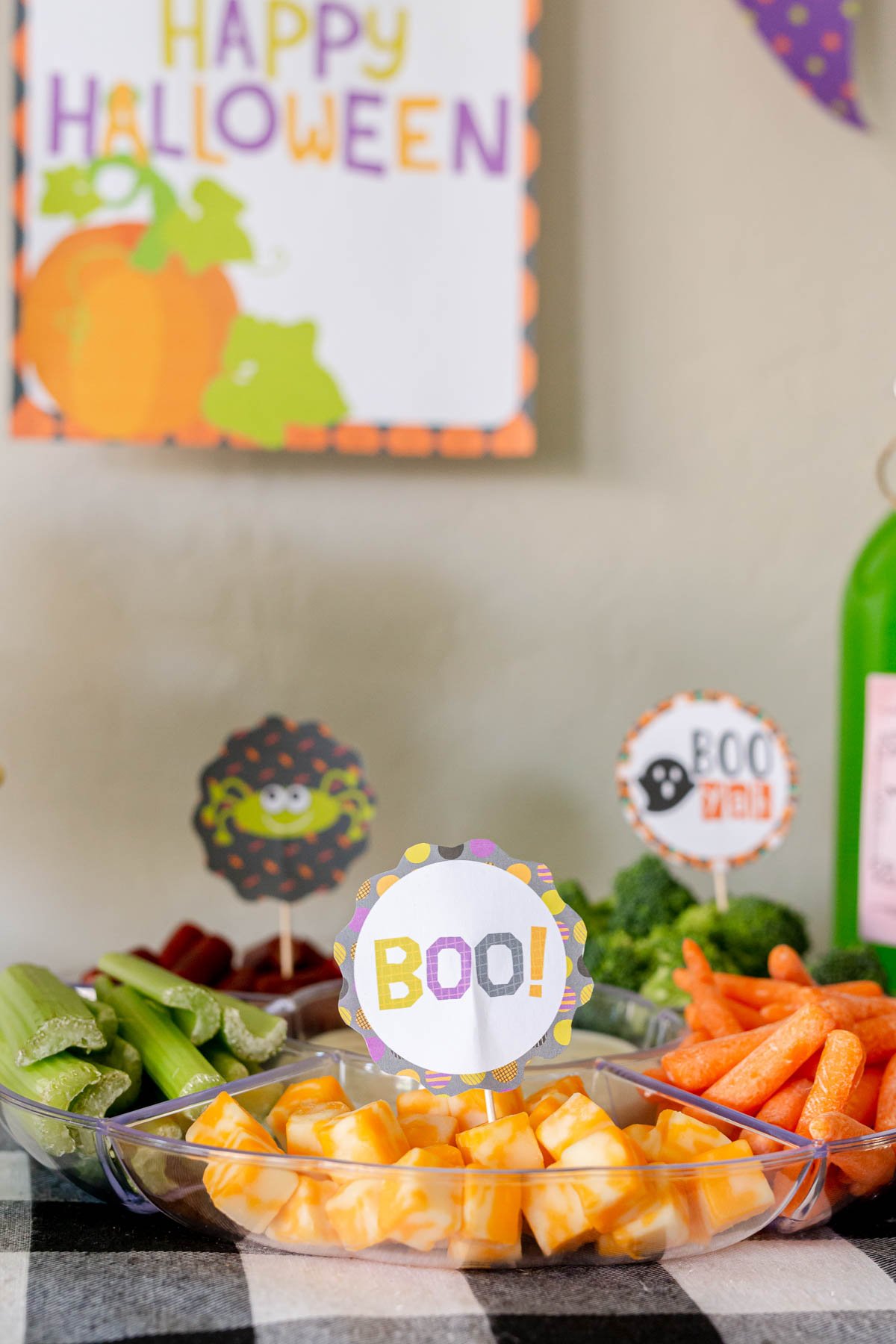 vegetable tray with Halloween cupcake toppers on top