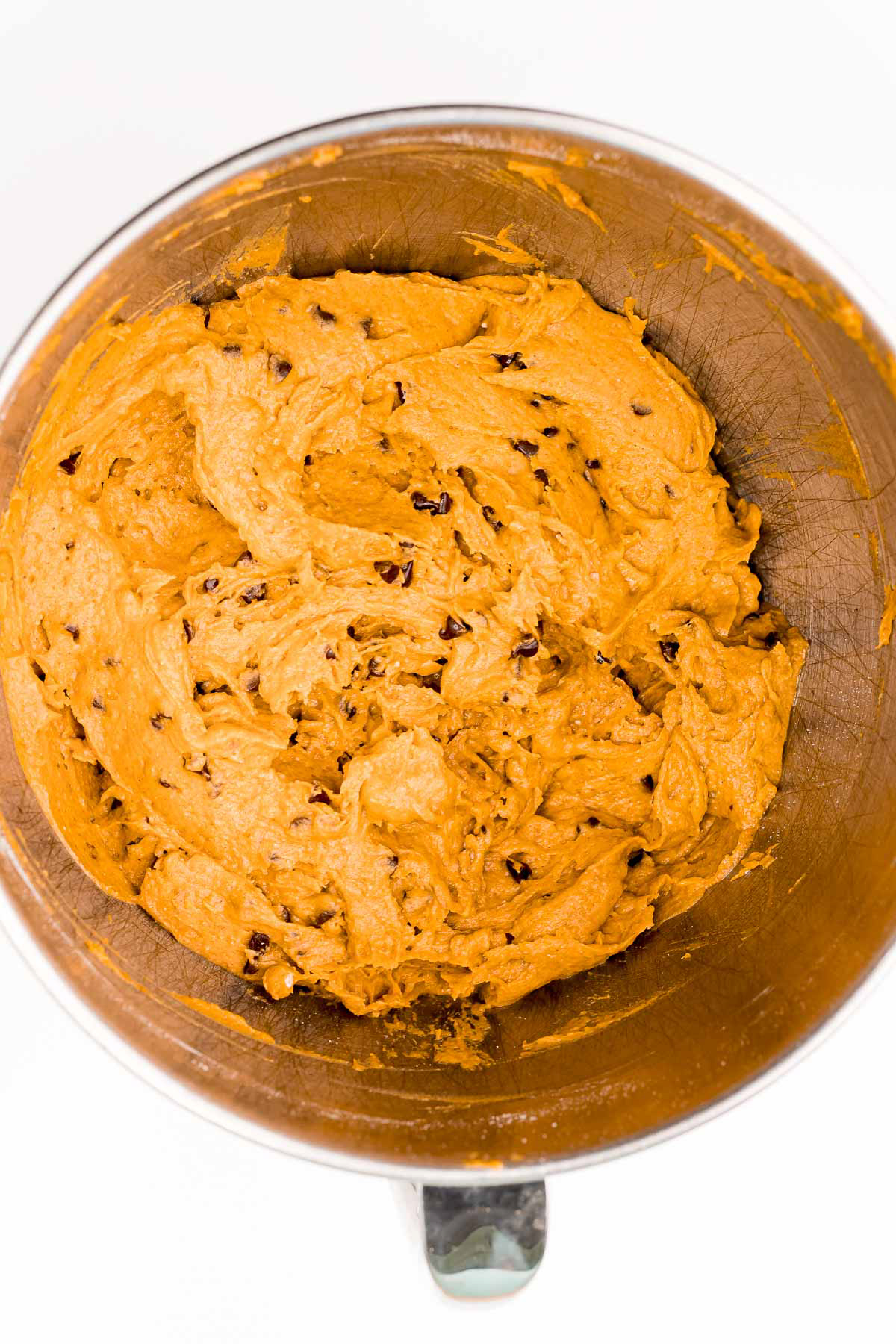 metal bowl with pumpkin cake mix cookie dough
