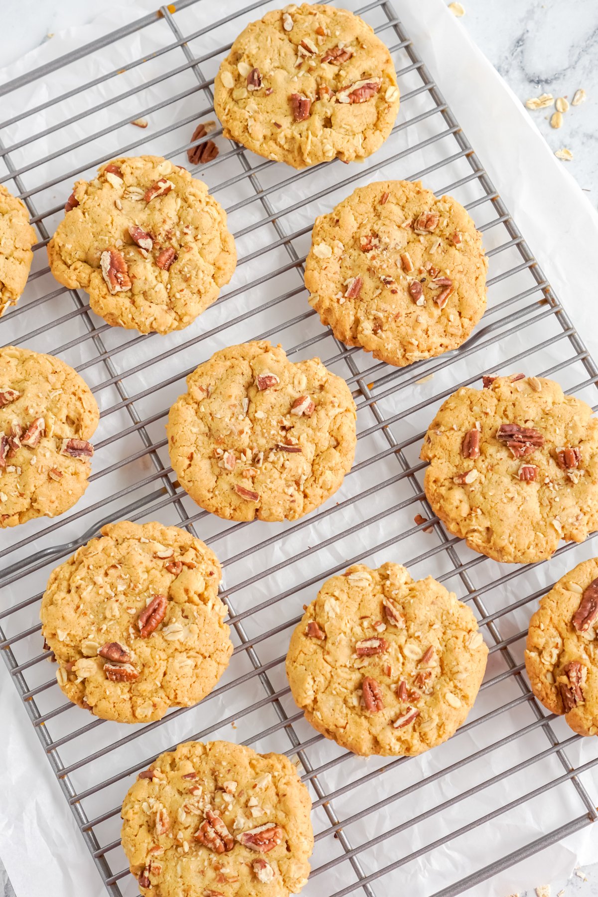 baked pumpkin oatmeal cookies on a cooling sheet