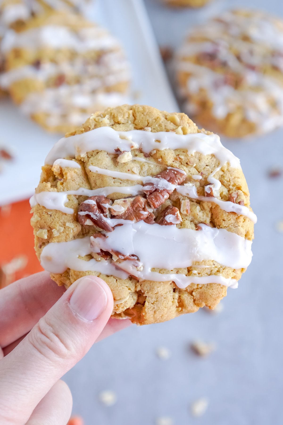 hand holding a pumpkin oatmeal cookie