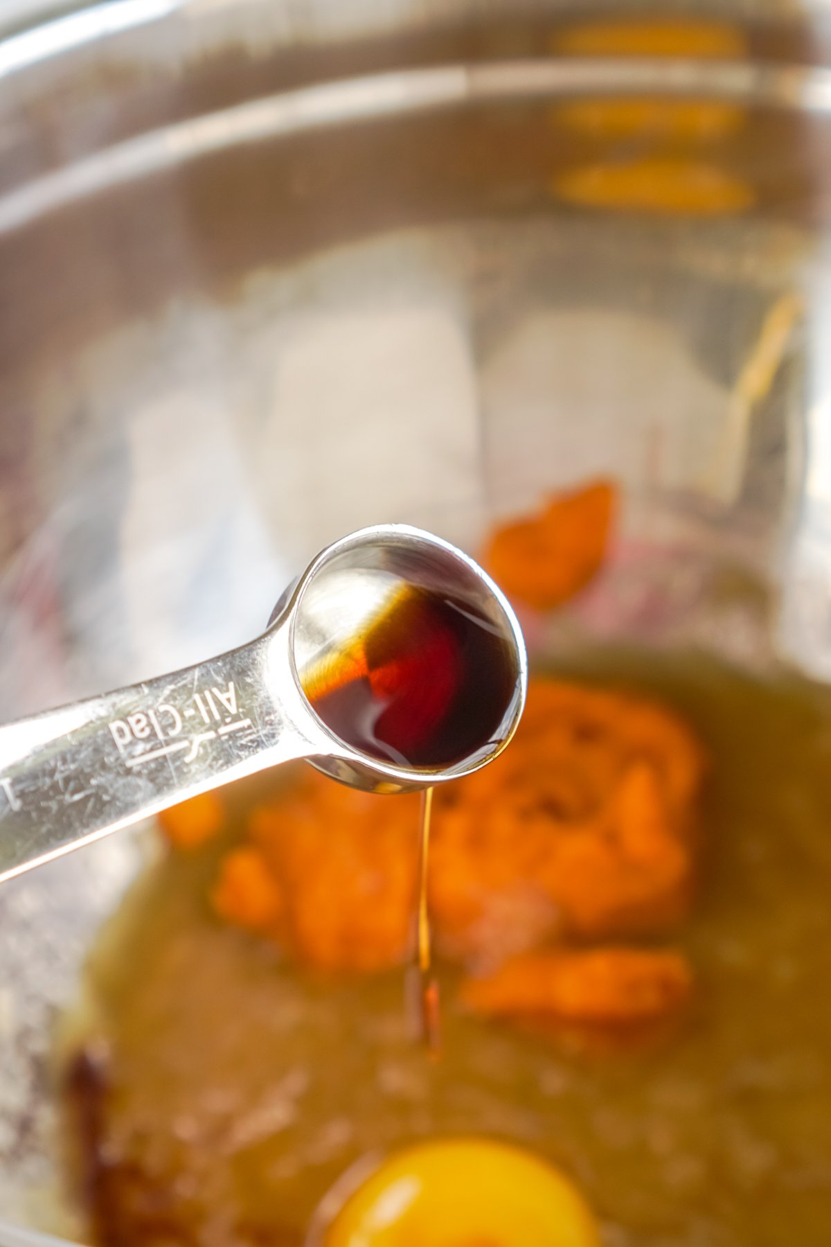 metal bowl with pumpkin and egg