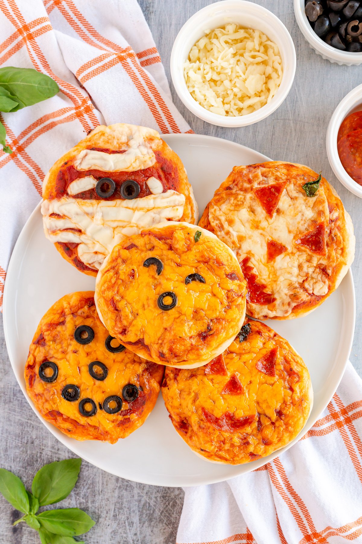 five pumpkin pizzas on top of each other