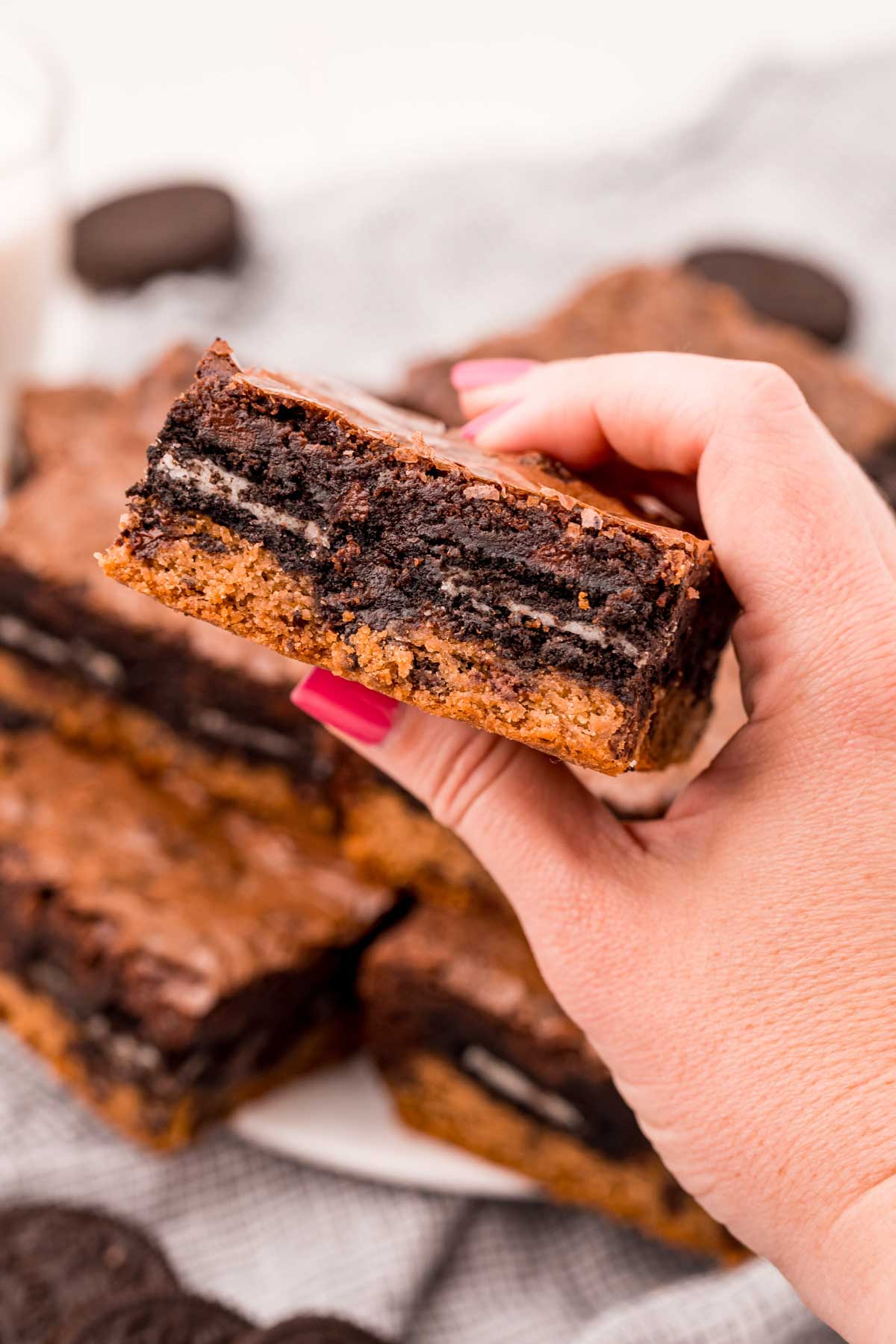 hand holding a slutty brownie