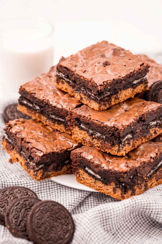 stack of slutty brownies on a white plate