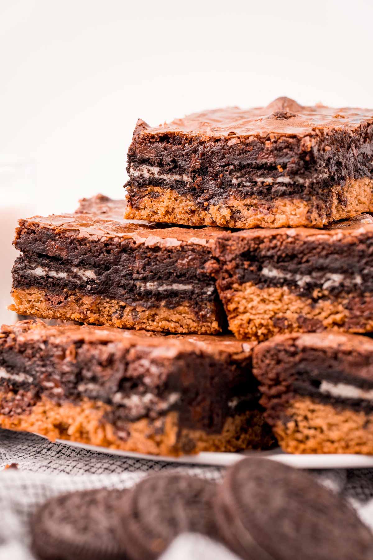pile of slutty brownies on a white plate