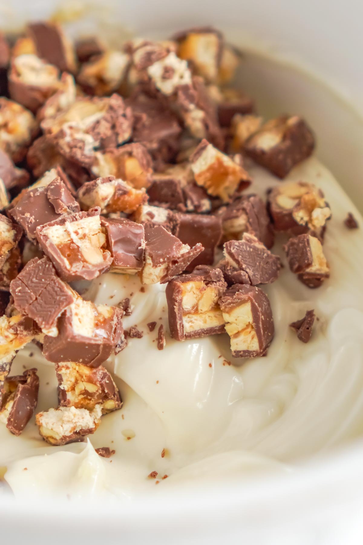 snickers in a bowl of creamy pie