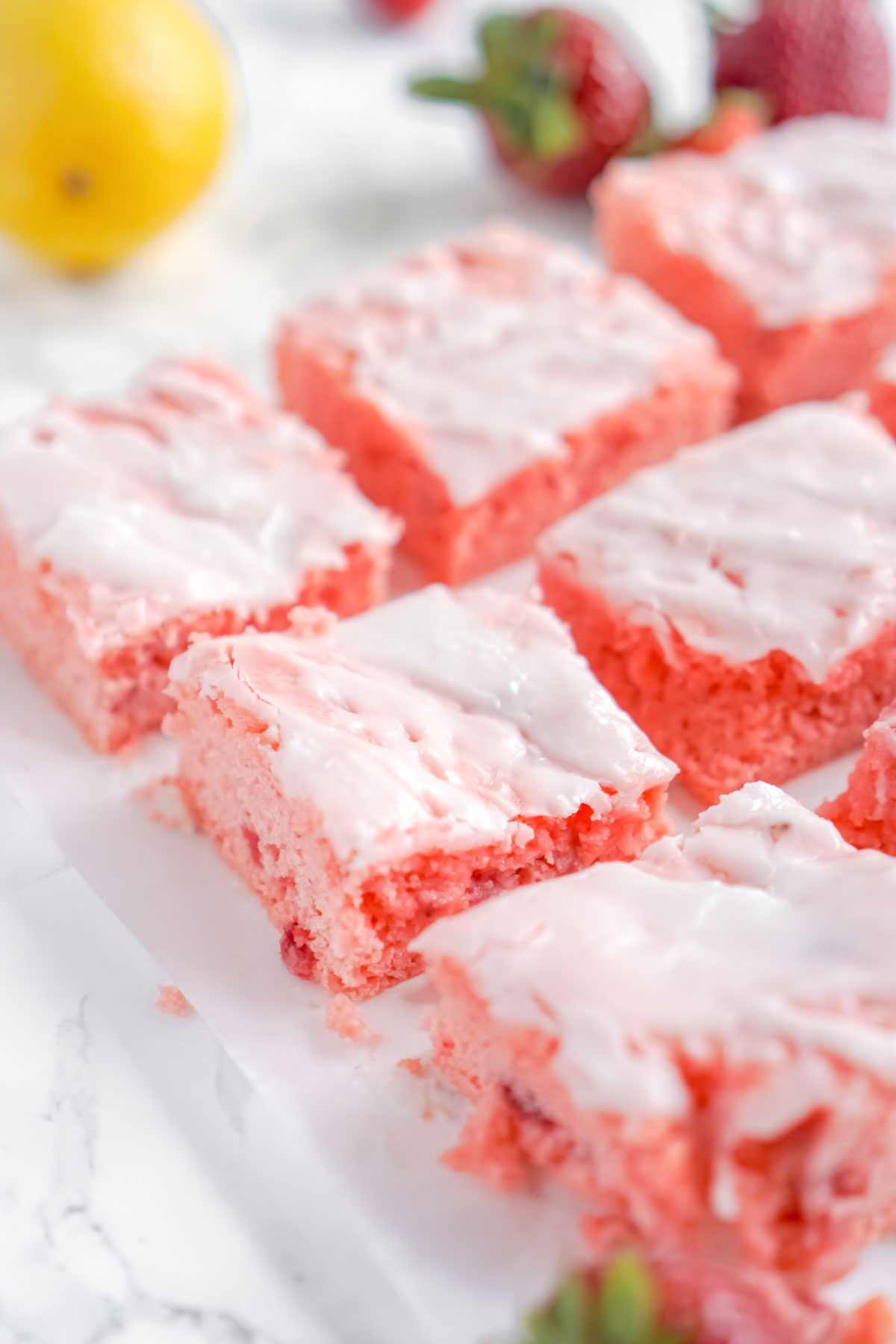 cut strawberries brownies with glaze