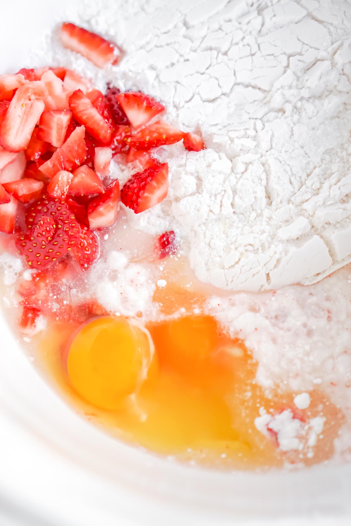 glass bowl with flour and strawberries