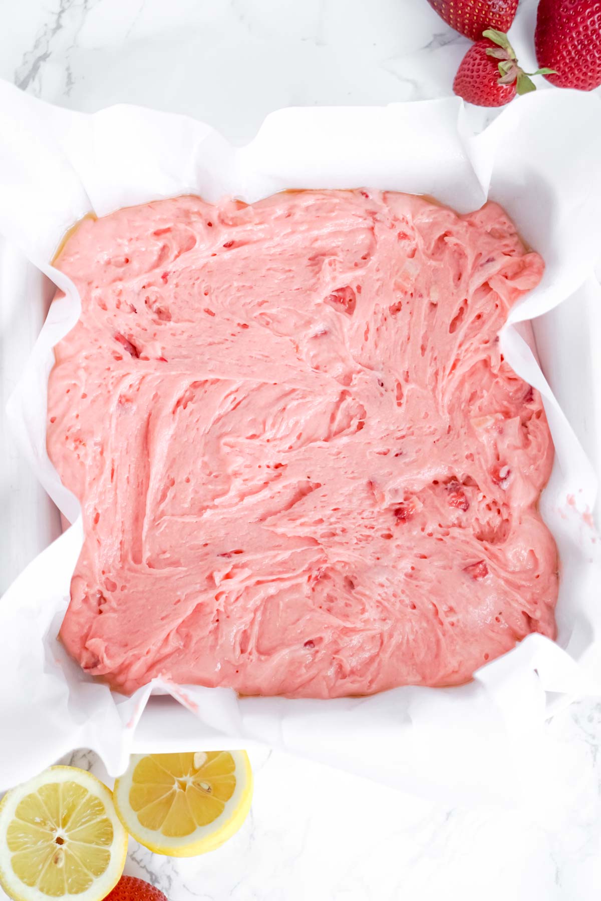 batter for strawberry brownies in a baking dish