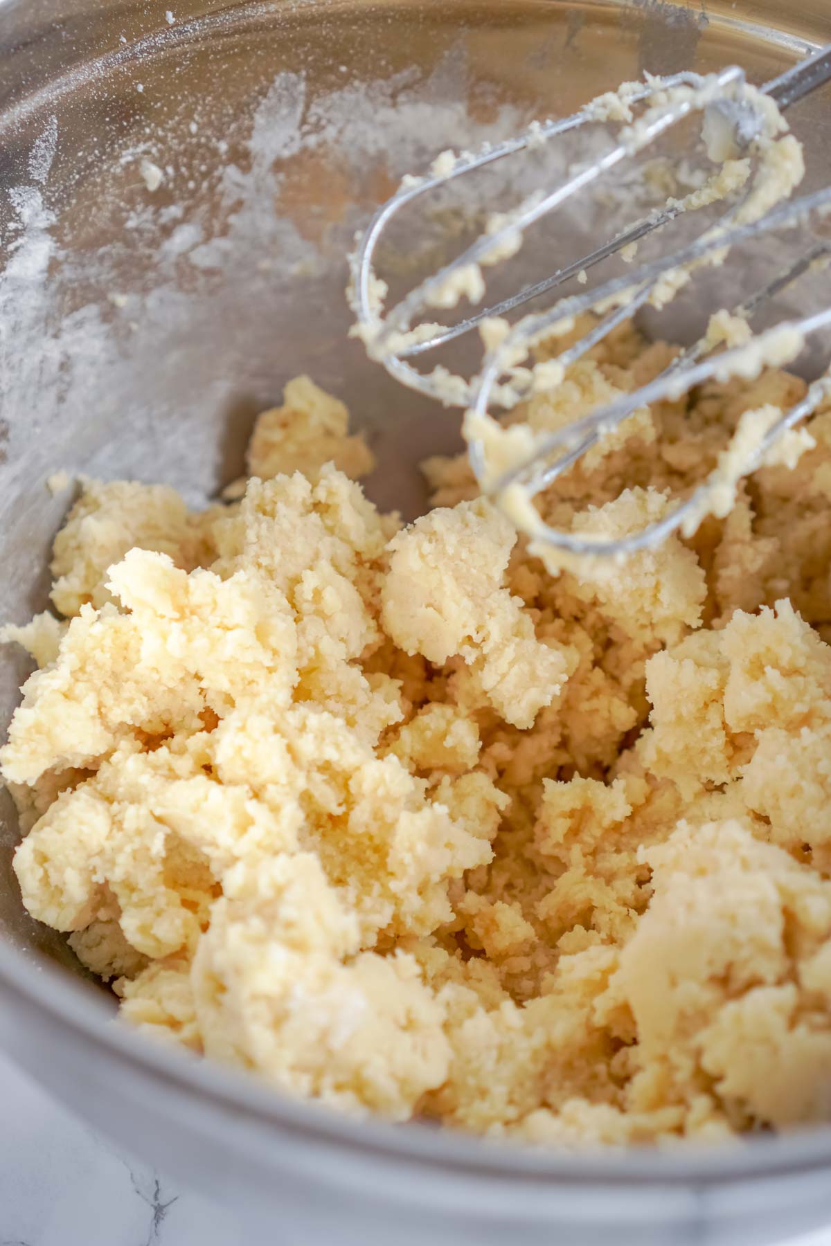 butter and sugar creamed in a glass bowl