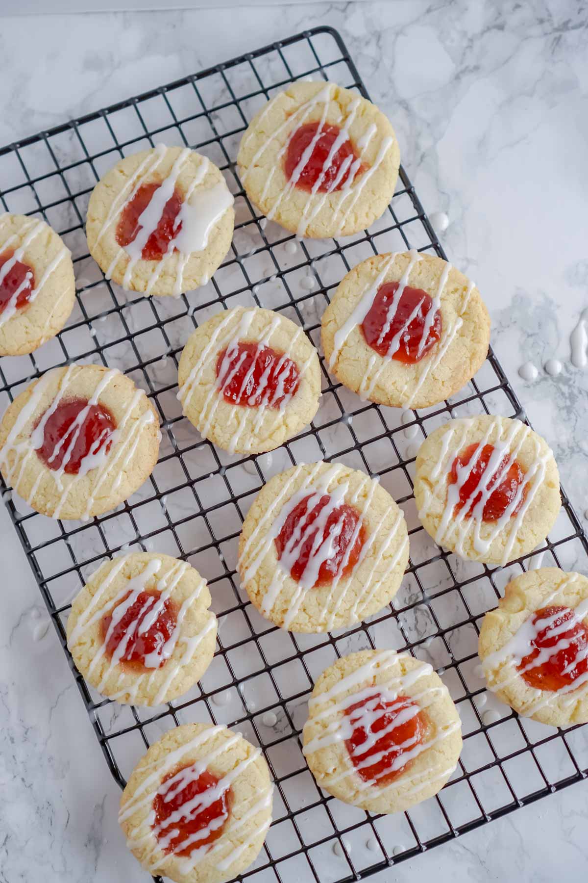 strawberry thumbprint cookies with glaze on top