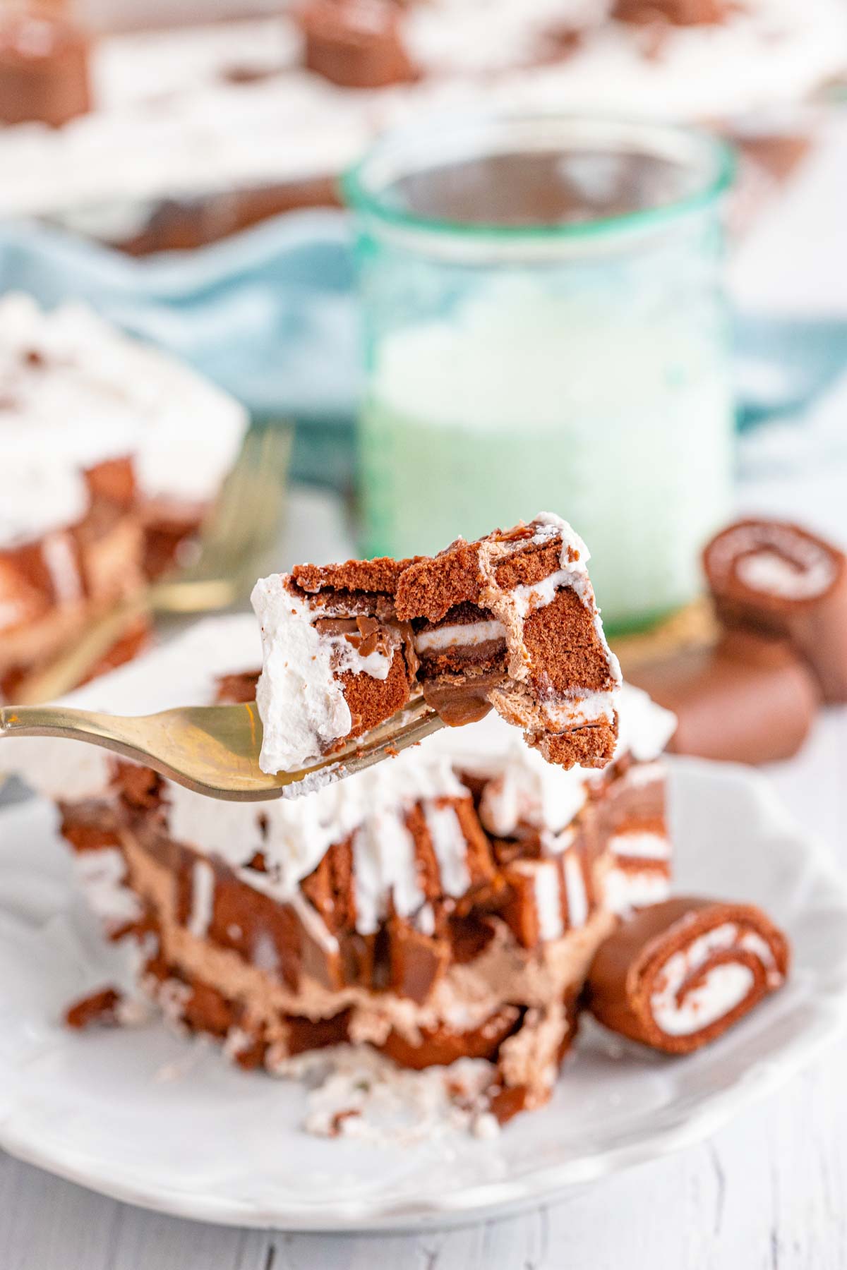 fork with a bite of swiss roll cake