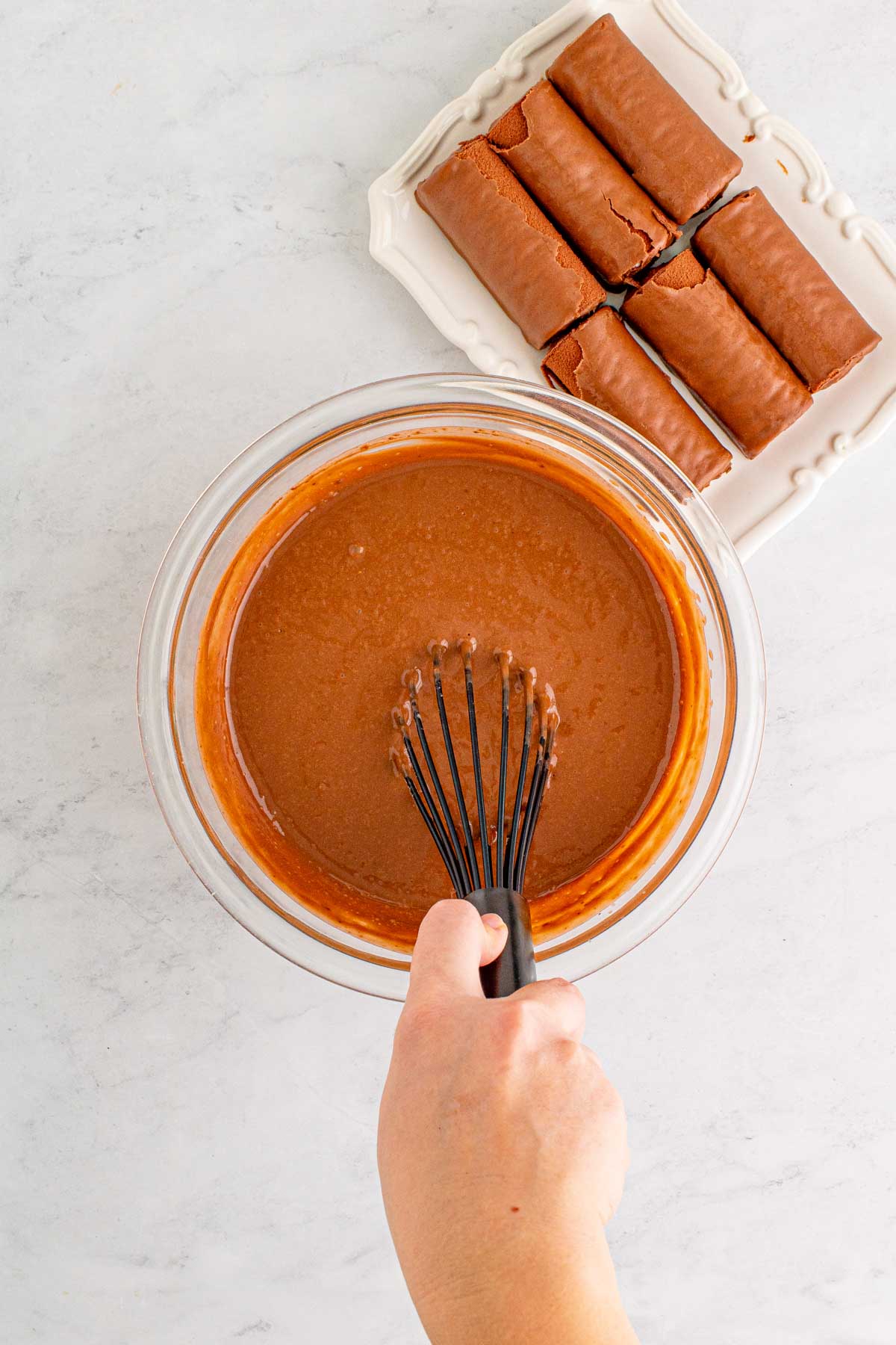 hand whisking chocolate pudding