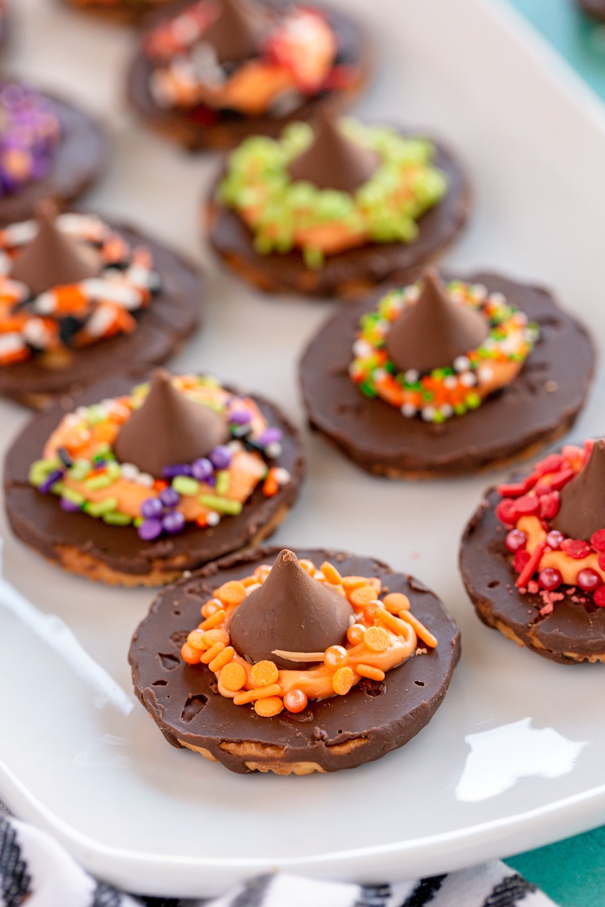 witch hat cookies on a white plate