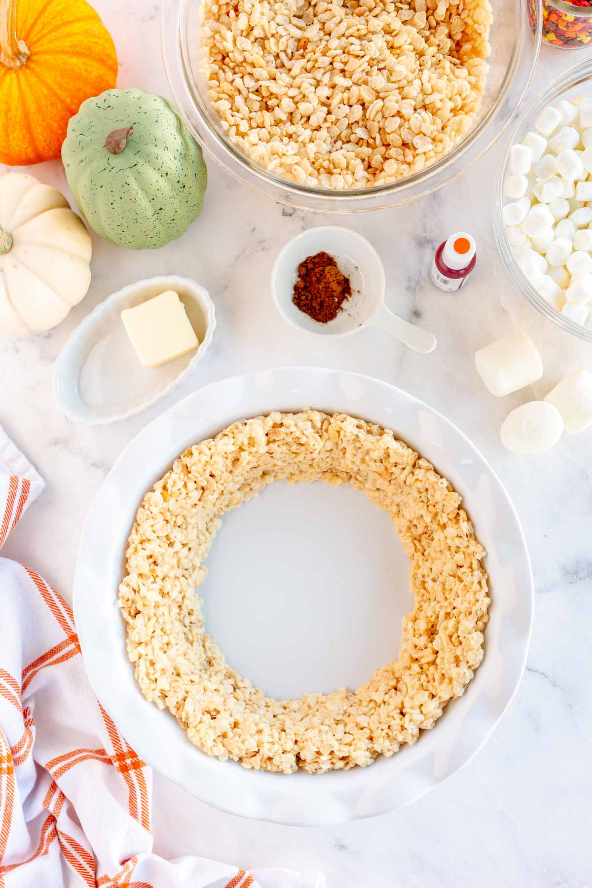 white pie pan with a rice krispie treat crust