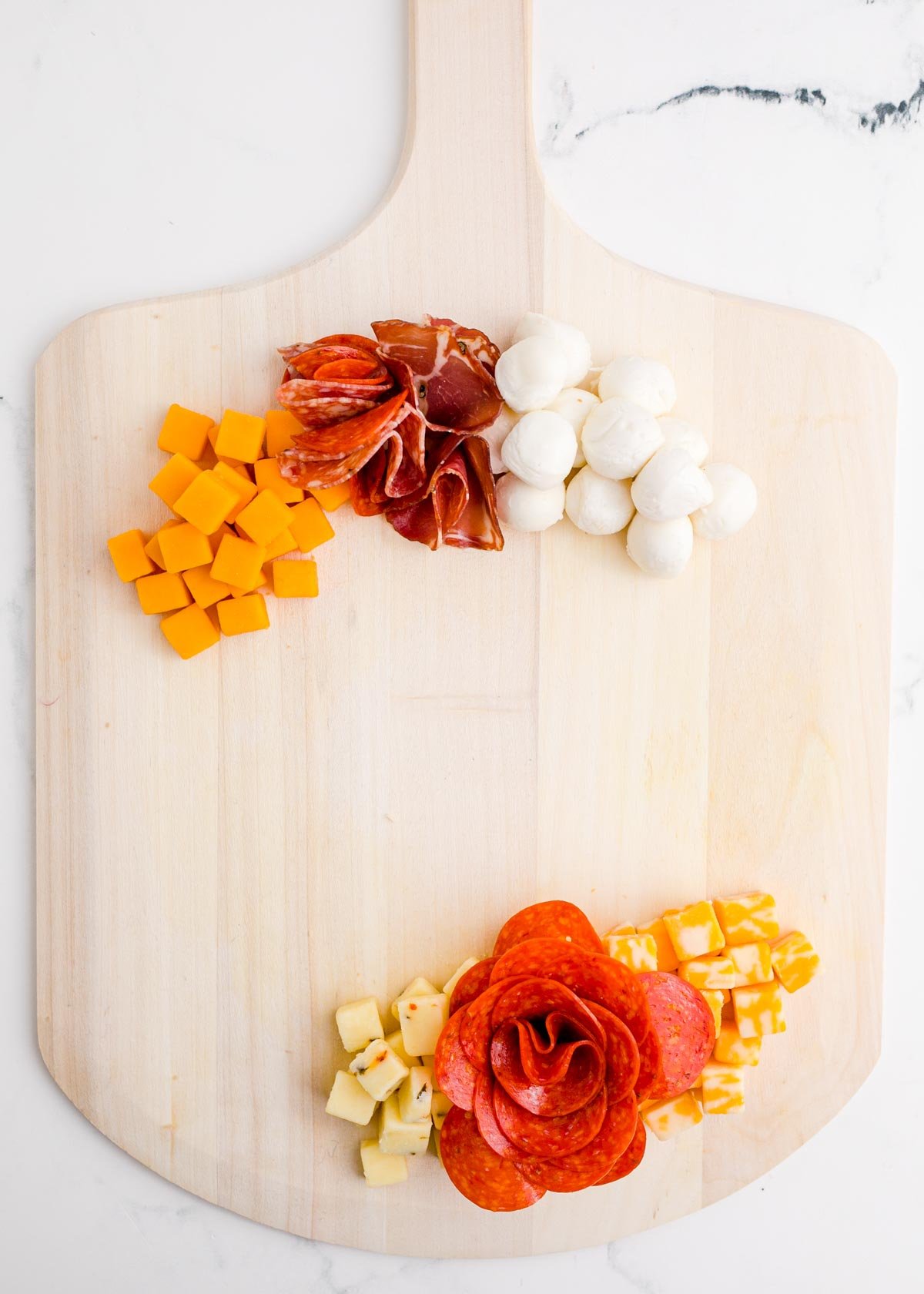 meats added onto a Christmas charcuterie board