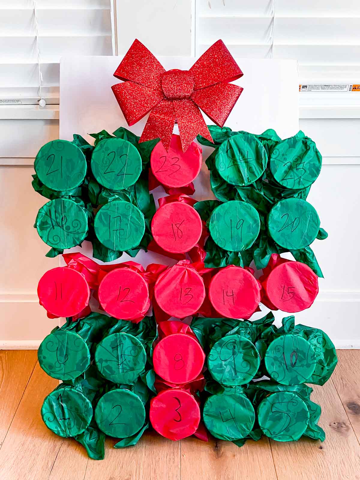 DIY advent calendar made out of plastic cups and tissue paper