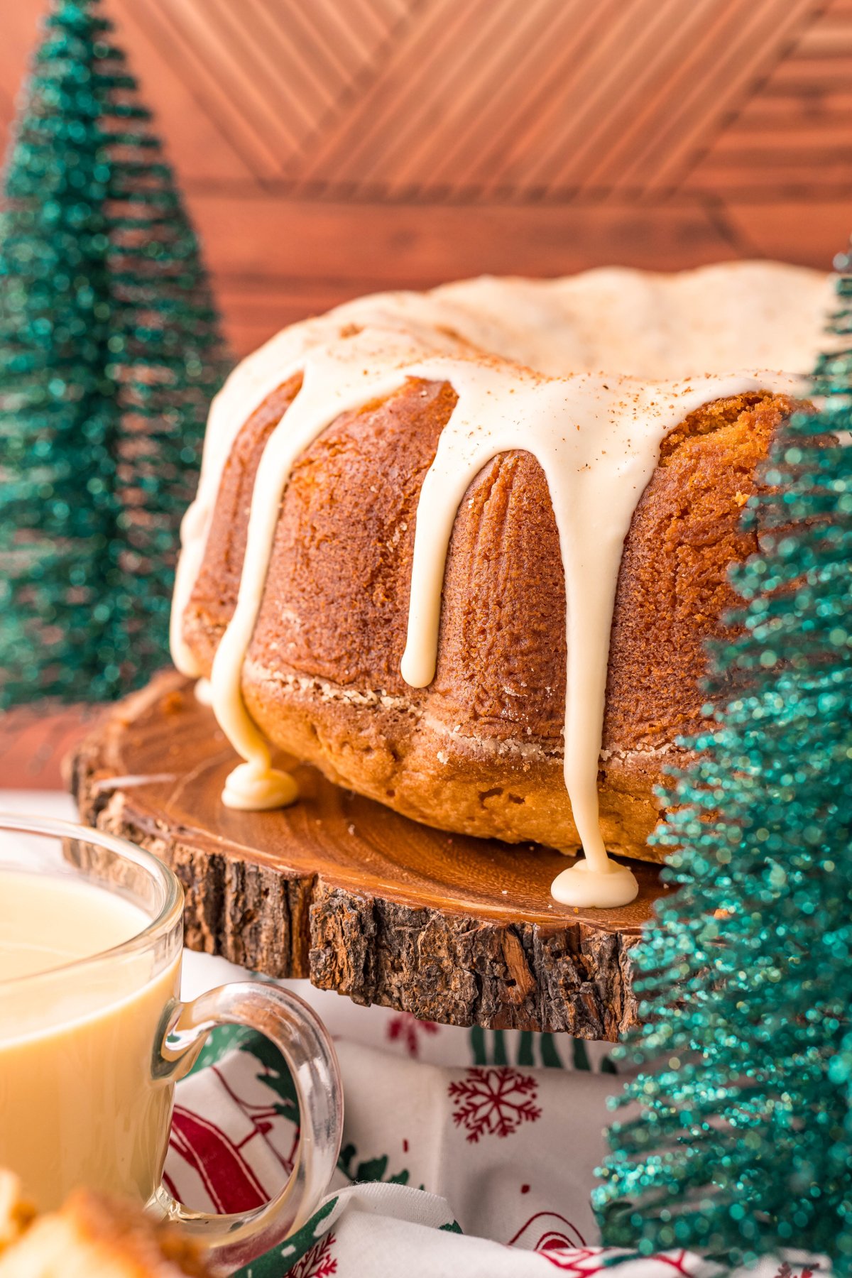 Eggnog pound cake on a wood cake stand