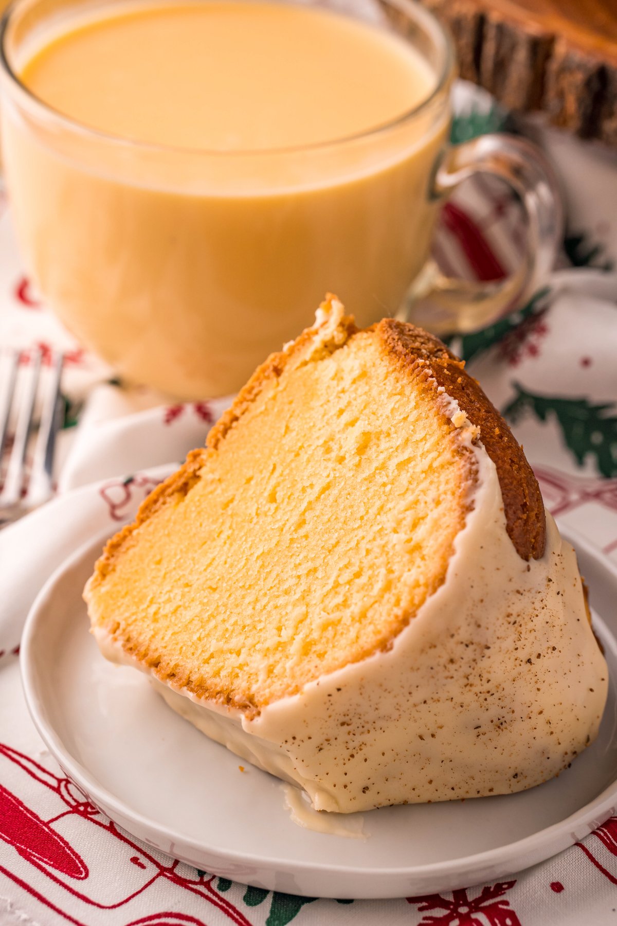 piece of eggnog pound cake and a glass of eggnog