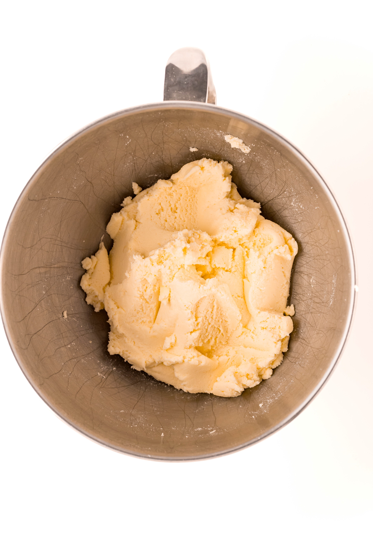 creamed butter and sugar in a metal pan