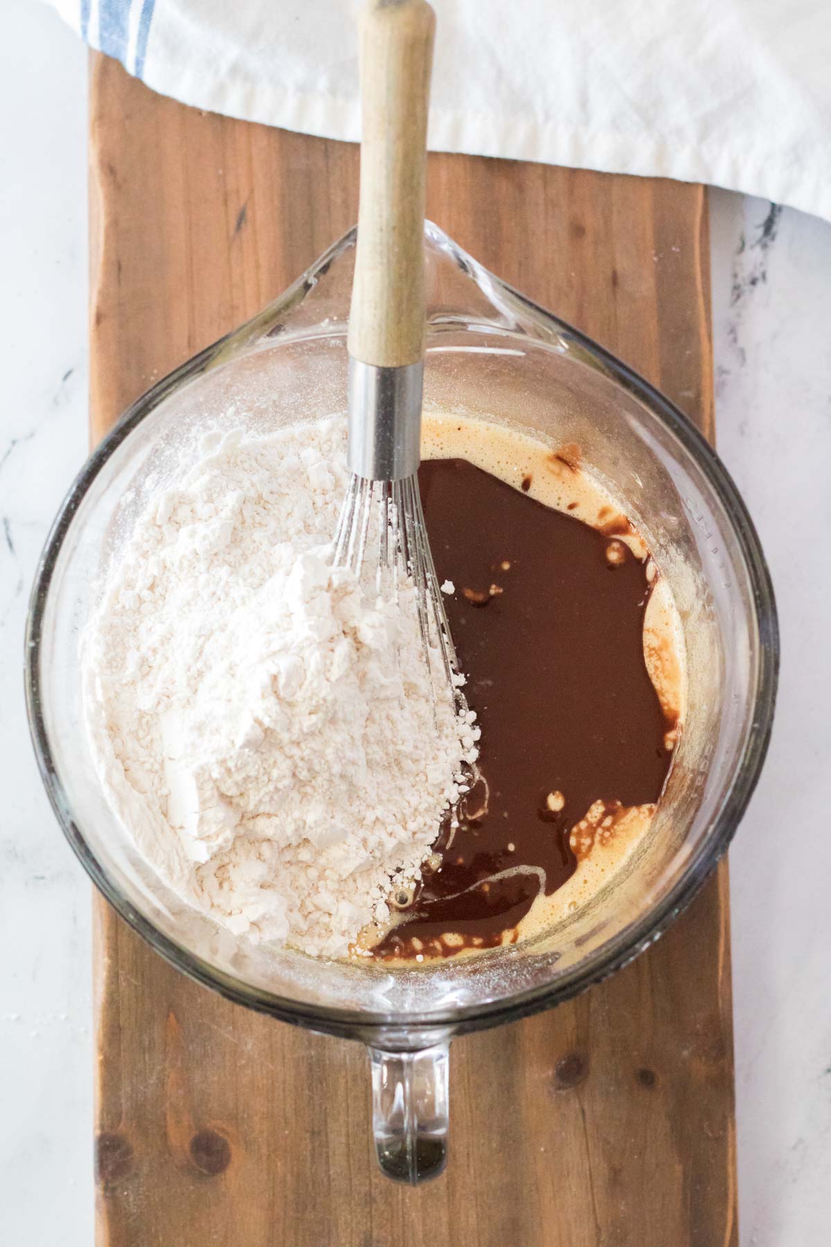 adding flour to chocolate mixture