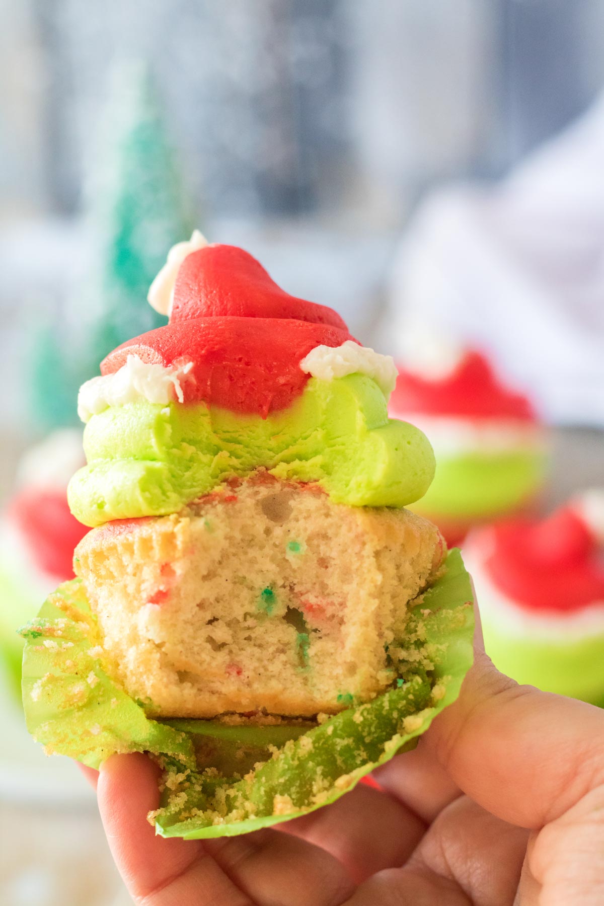 Grinch cupcakes with a bite taken out of it