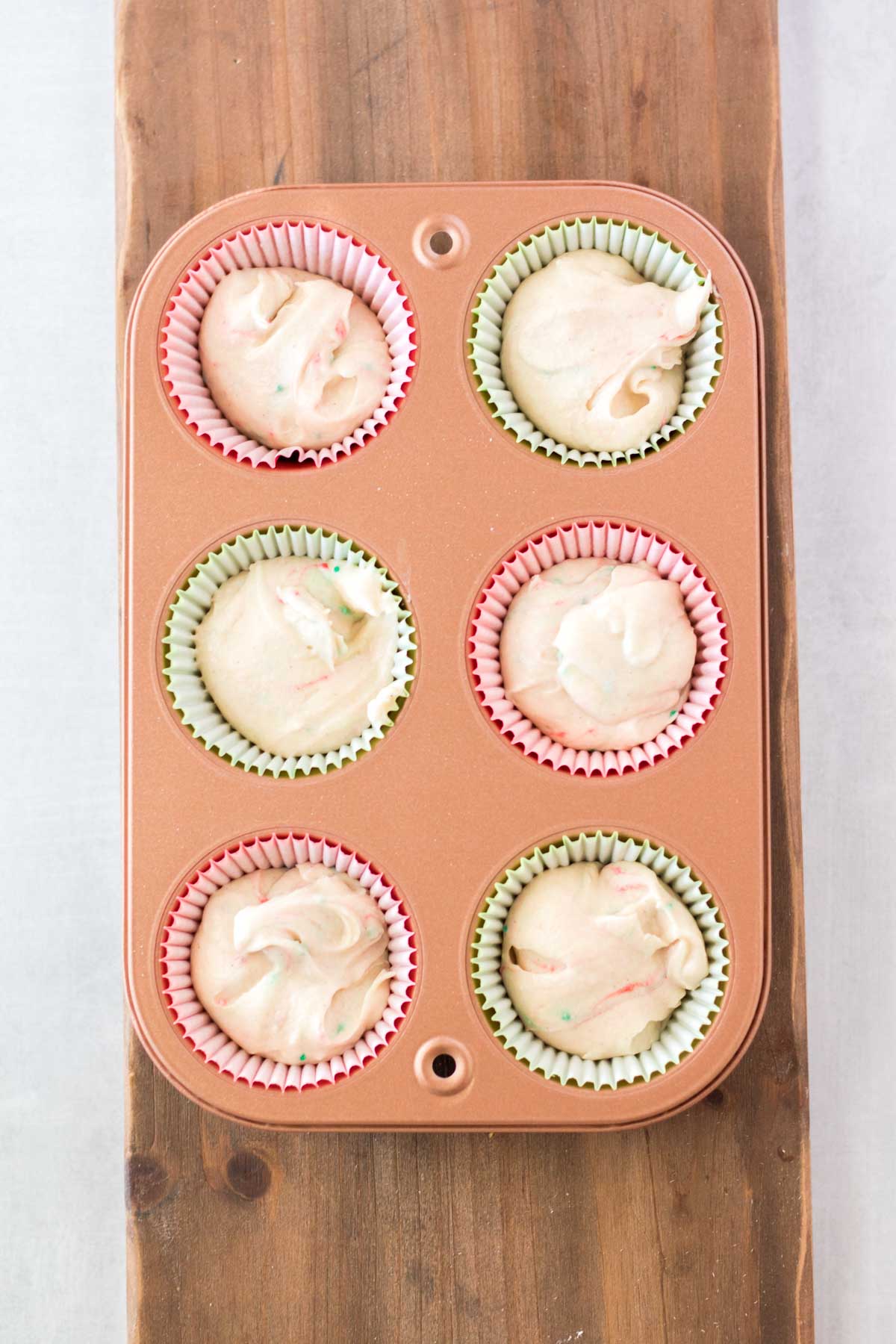 cupcake batter in cupcake tins