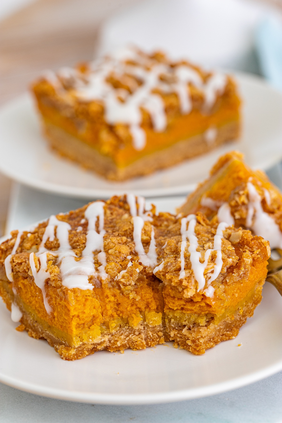 pumpkin bar with streusel topping with a bite out of it