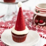 santa hat cupcakes on white plates