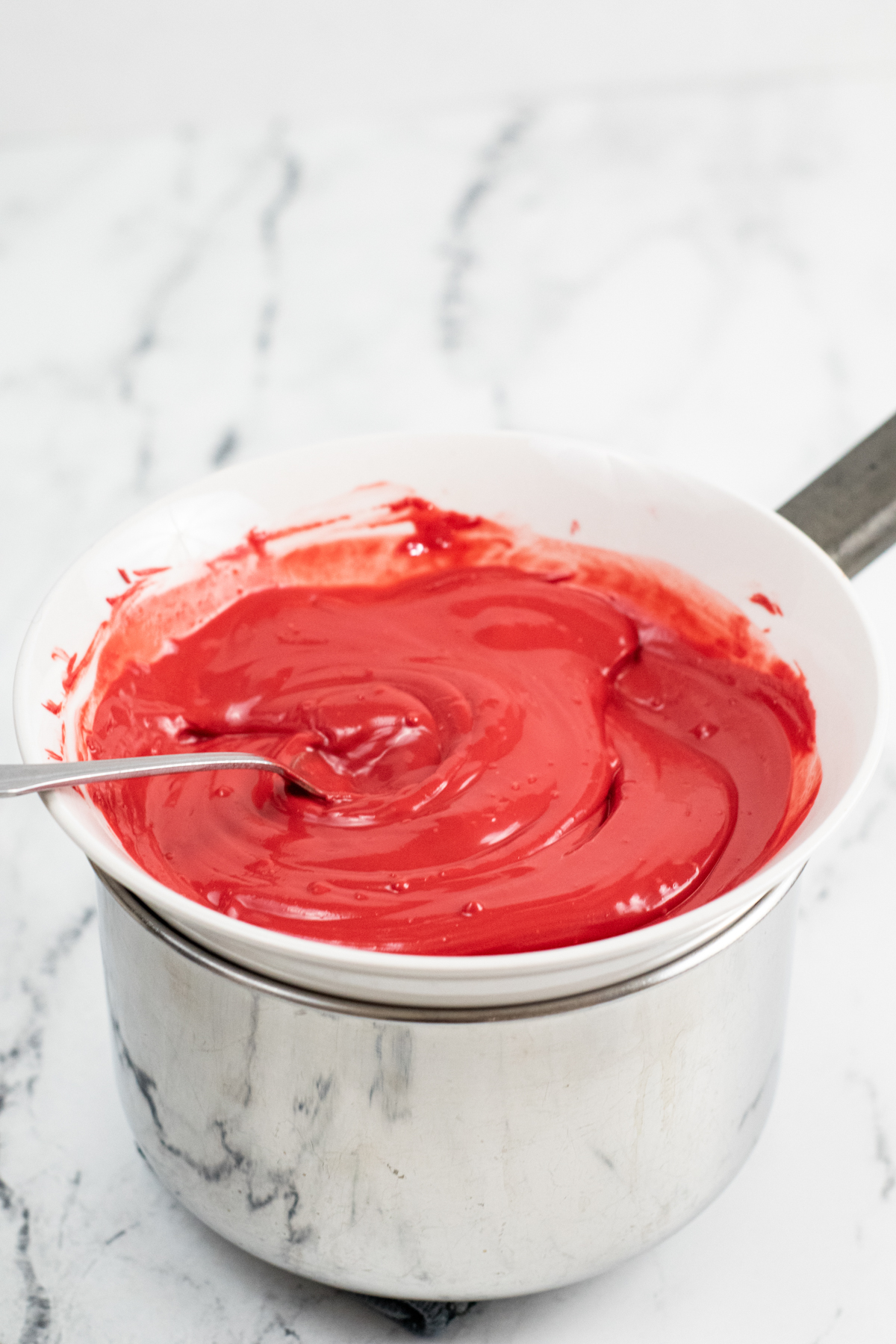 red candy melts melted on a double boiler