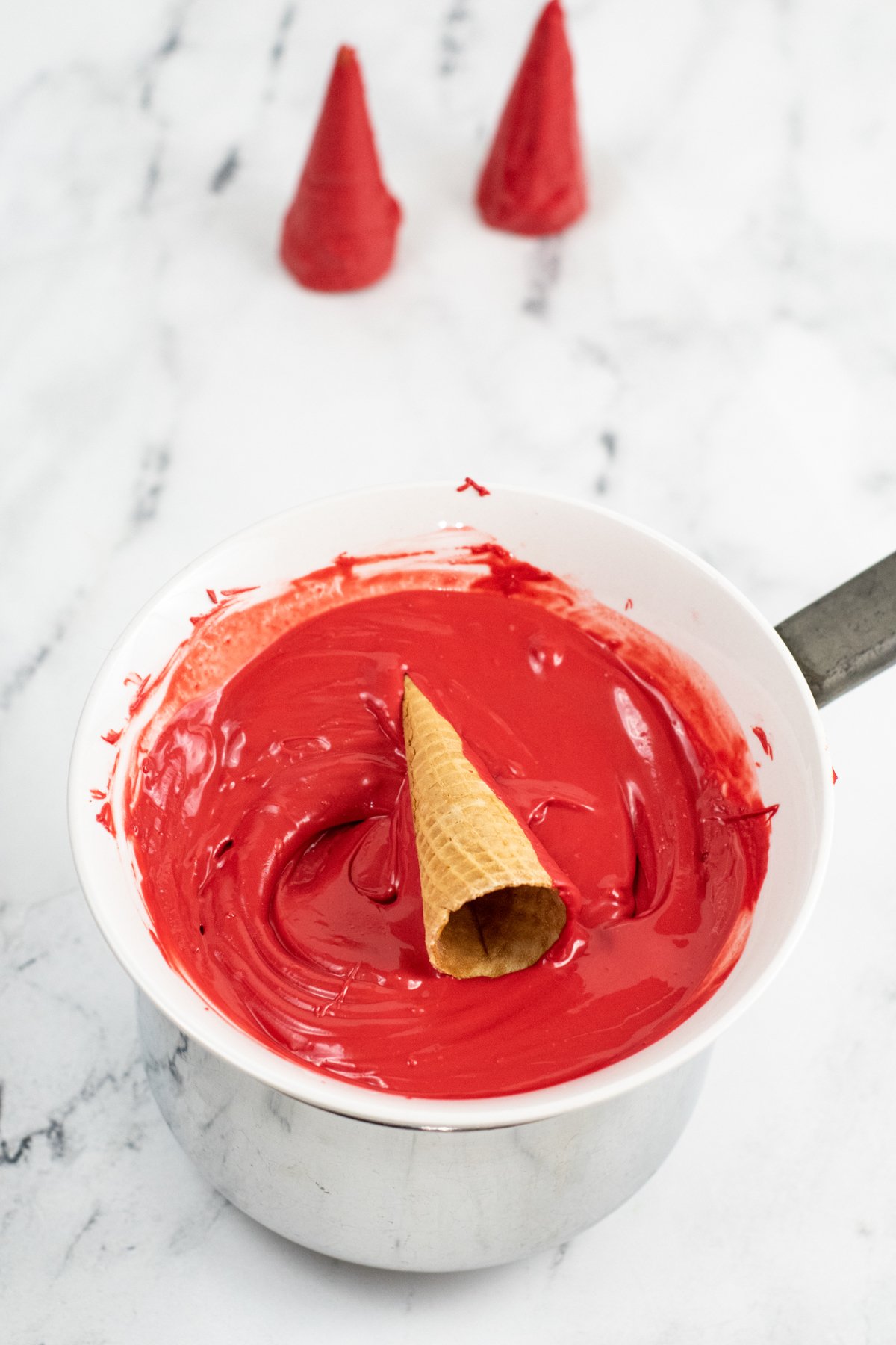 sugar cone in a bowl of candy melts