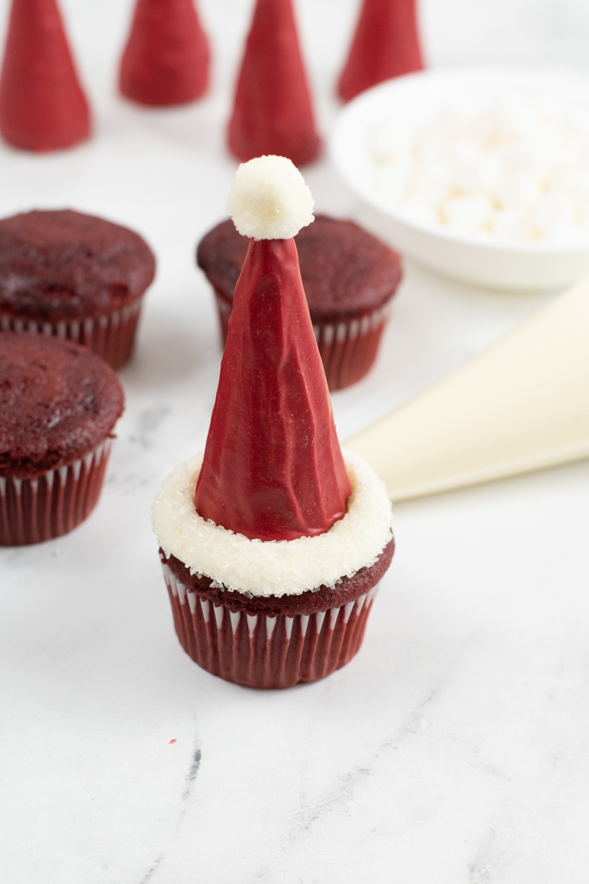 santa hat cupcake with blank cupcakes in the background