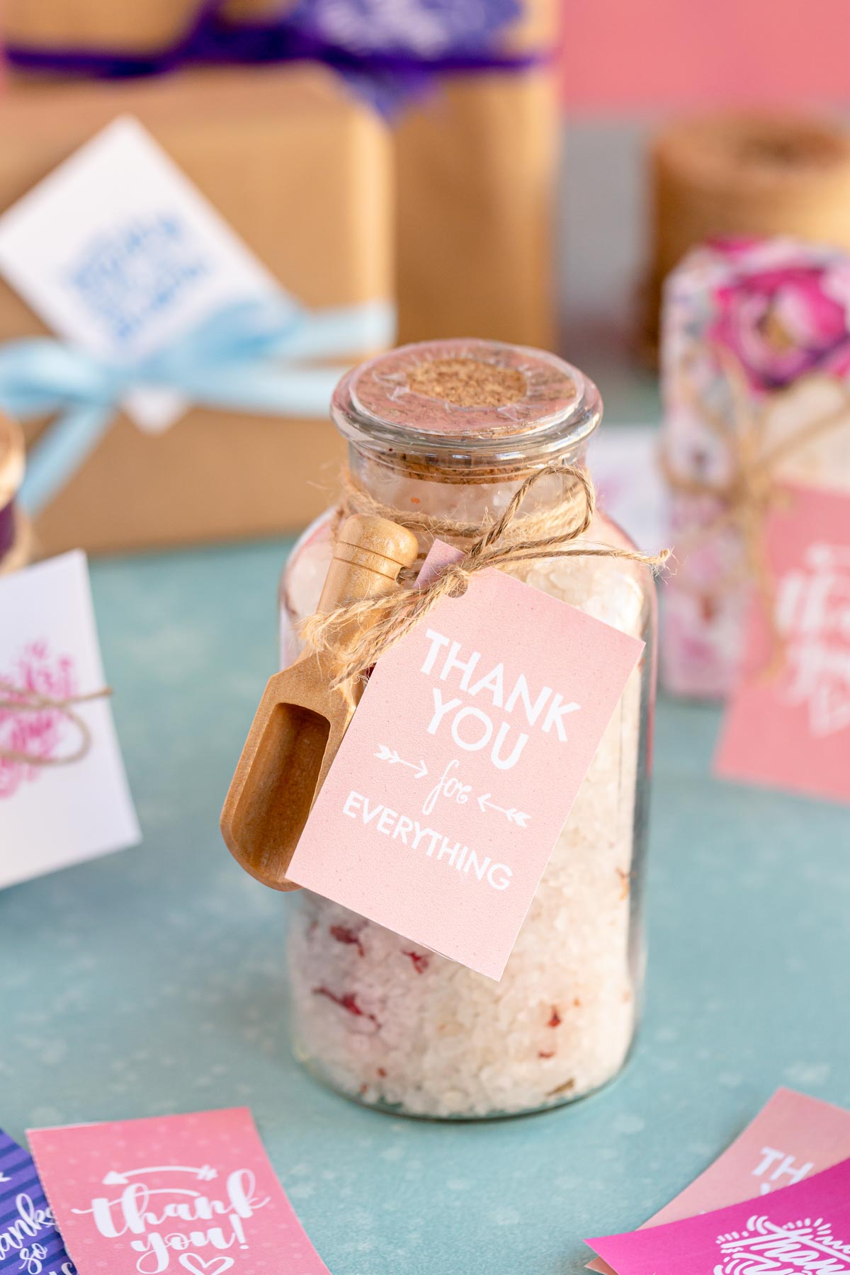 glass jar with bath salts and a thank you tag