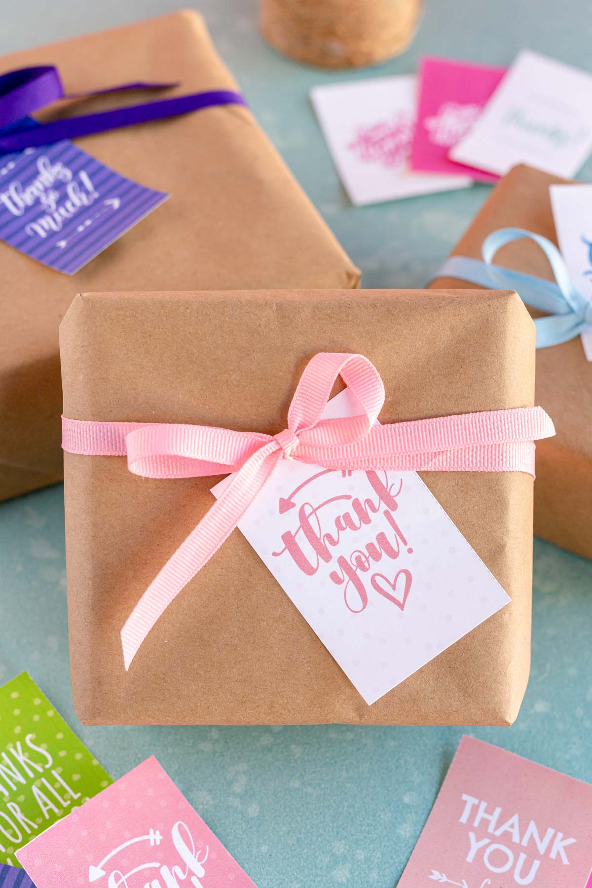 box wrapped in brown paper with a thank you tag