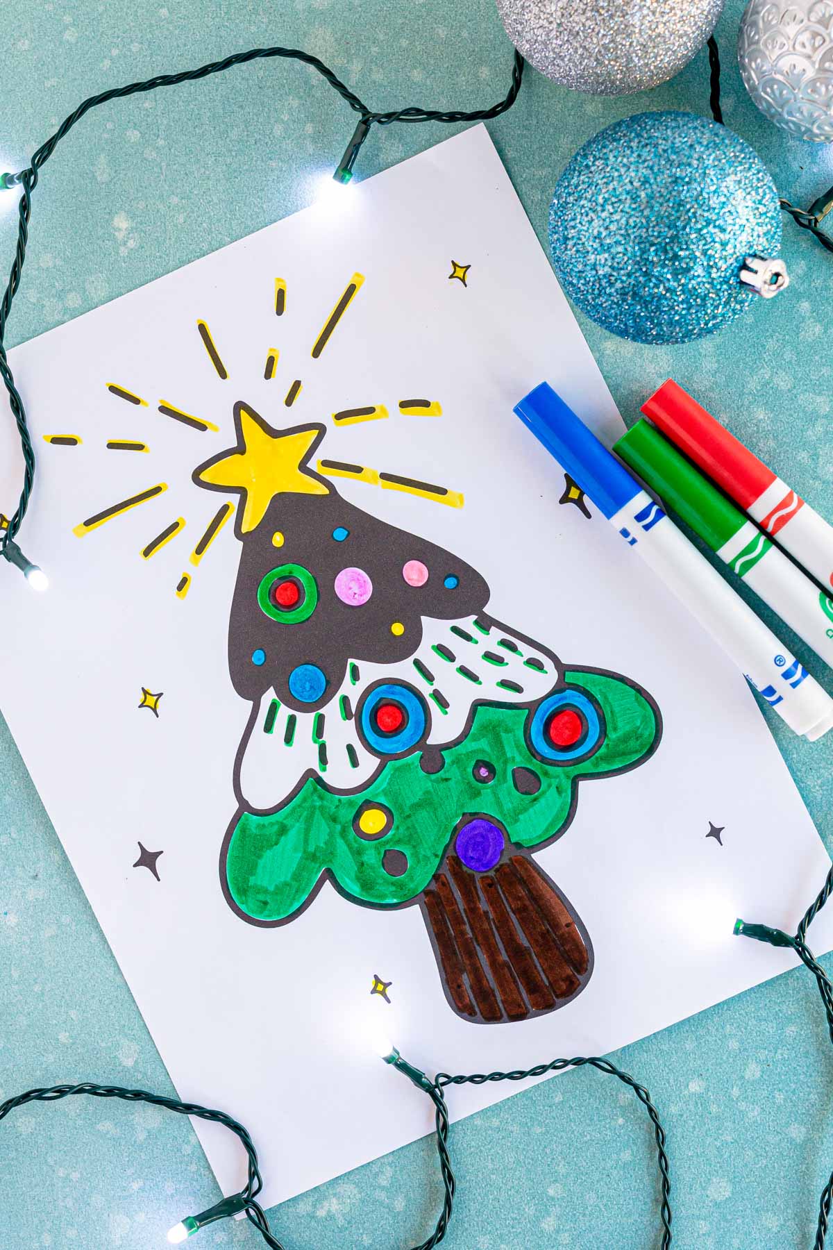 Christmas tree coloring page with markers