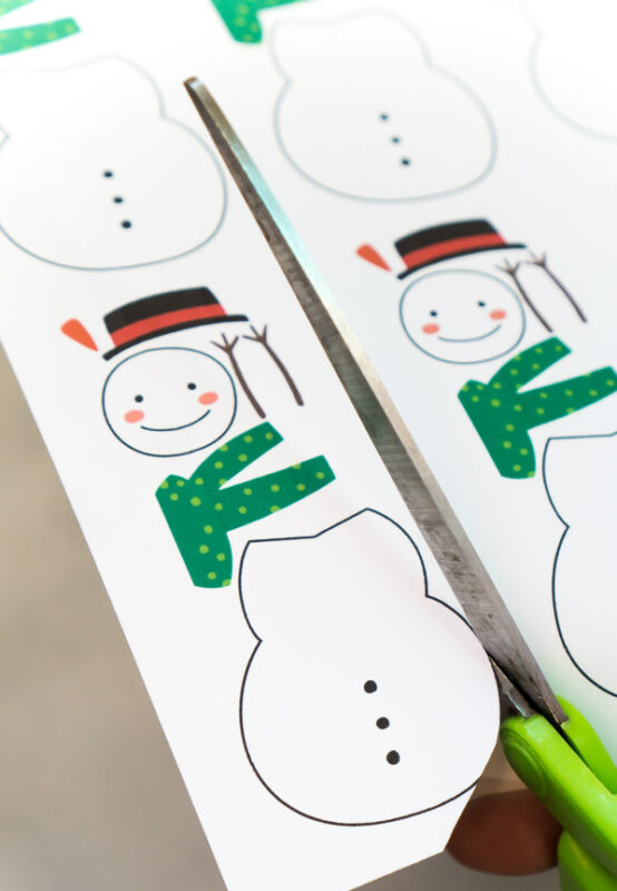 scissors cutting out roll a snowman game pieces