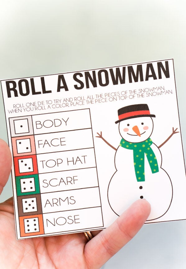hand holding a roll a snowman game