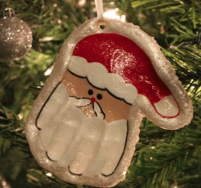 santa ornament made out of a painted handprint