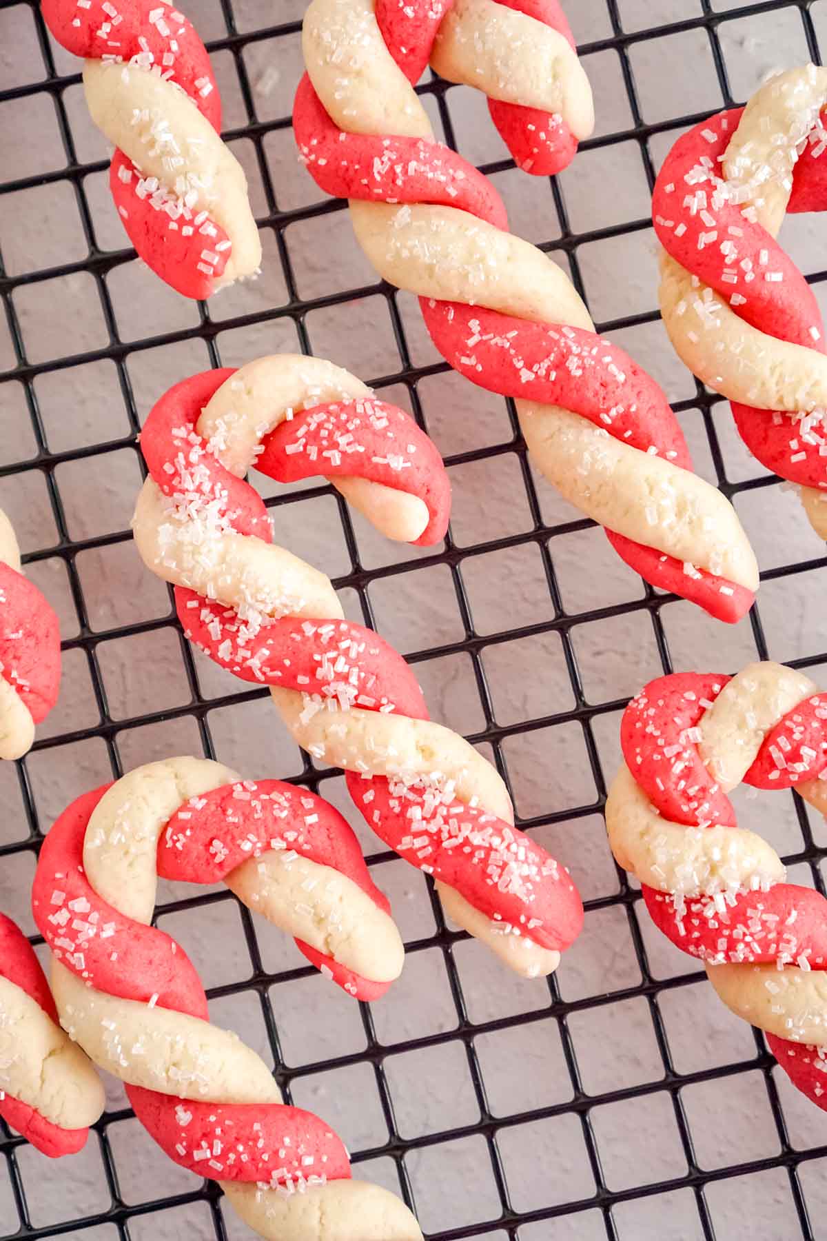 candy cane cookies on a cooling rack