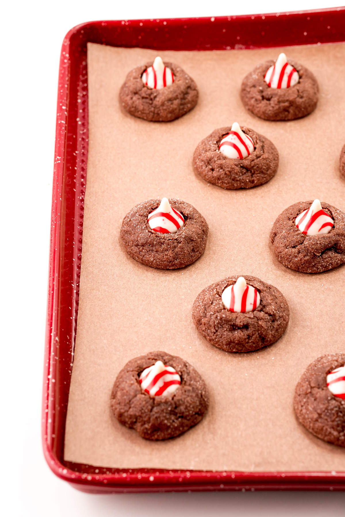 chocolate peppermint thumbprint cookies on a baking sheet