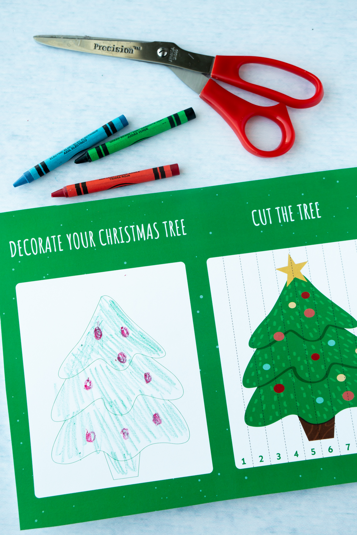 Christmas activity sheets with a tree decorated