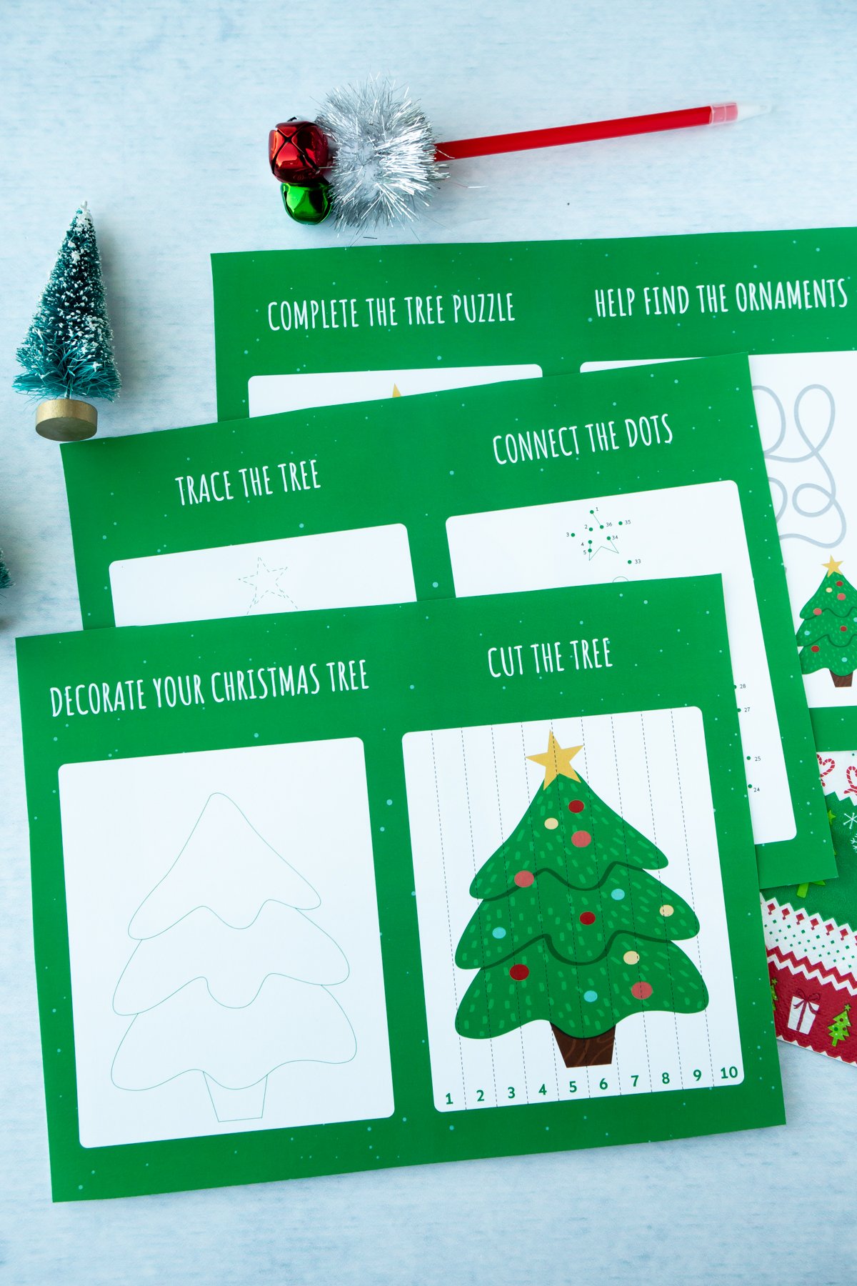 Three Christmas activity sheets on top of each other