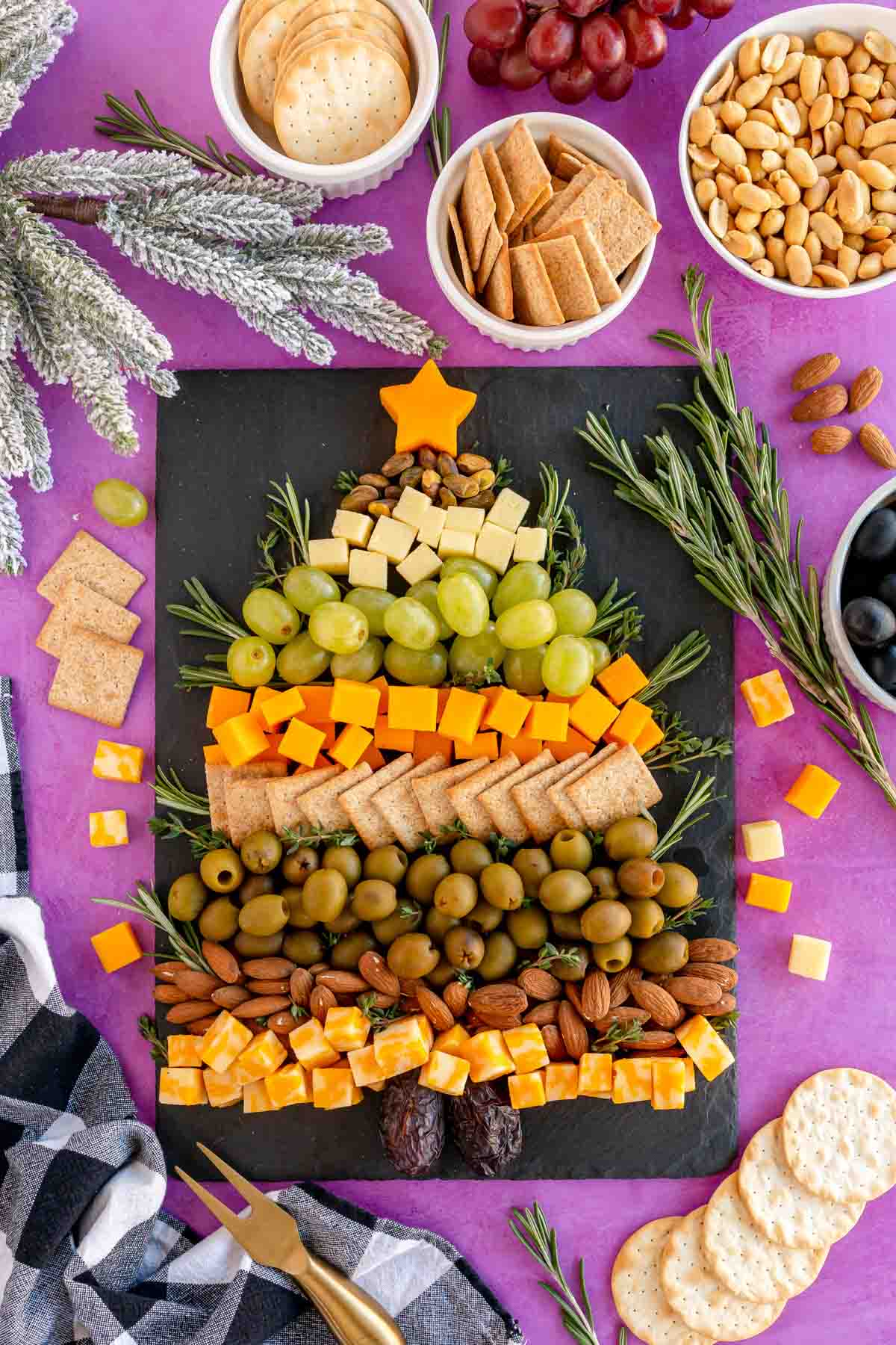 Christmas tree cheese board on a purple background