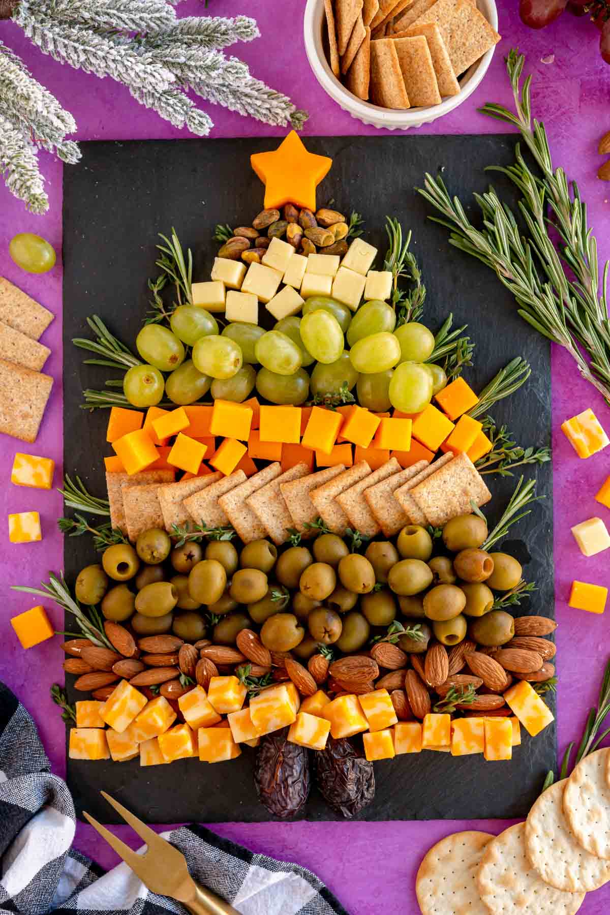 Christmas tree cheese board on a purple background