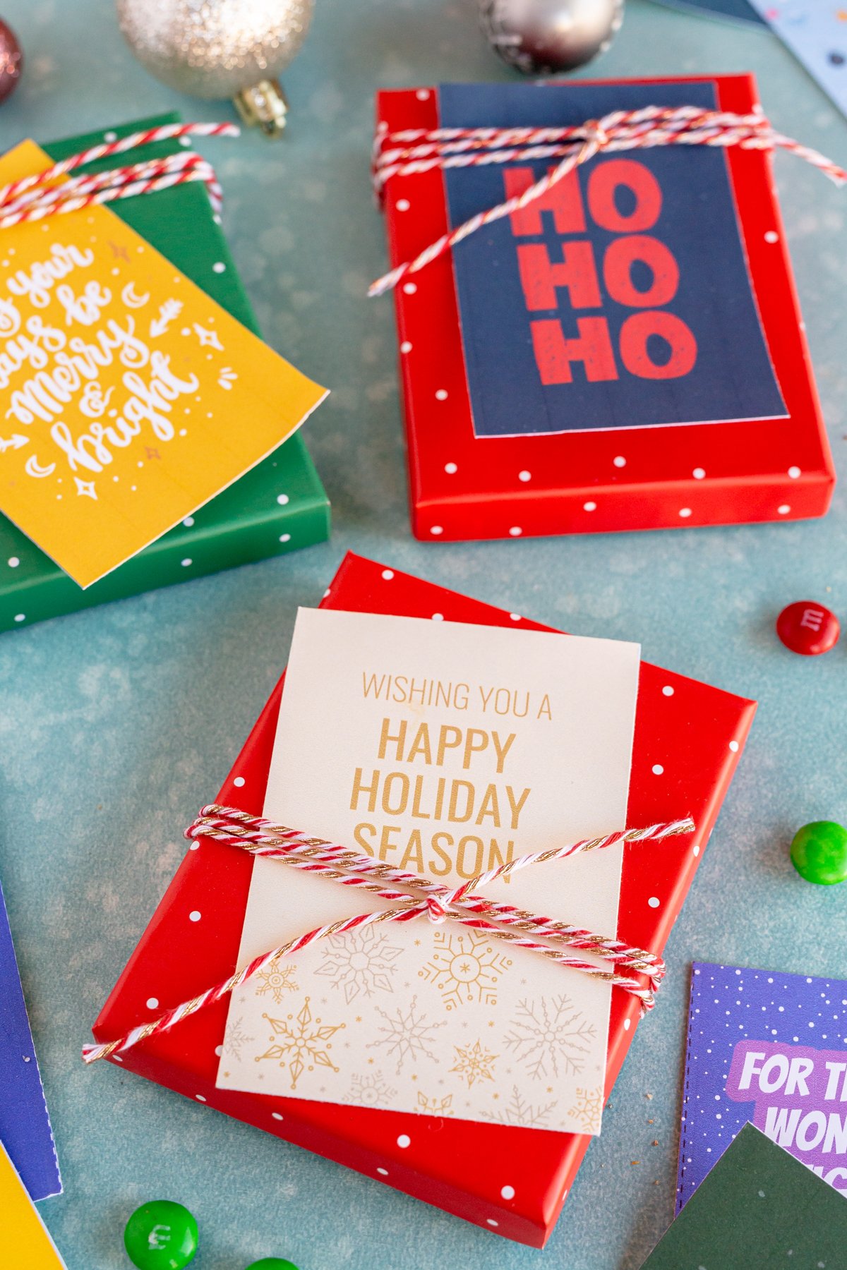 happy holidays gift tags on a red box