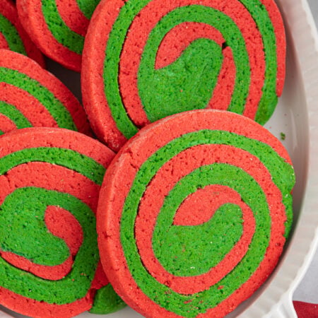 Pile of Christmas pinwheel cookies in a white bowl