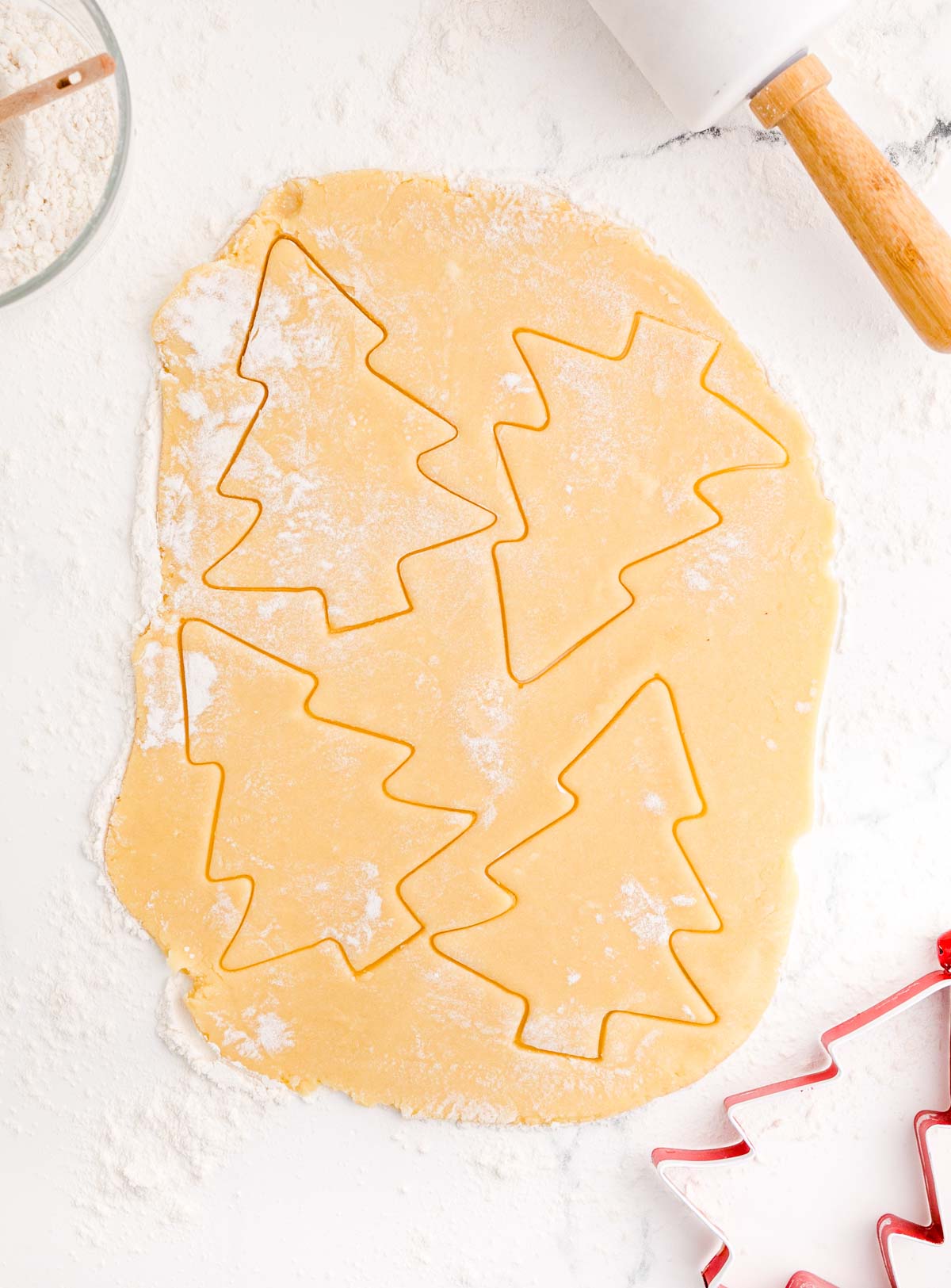 Christmas tree cookie cutter with cookie dough