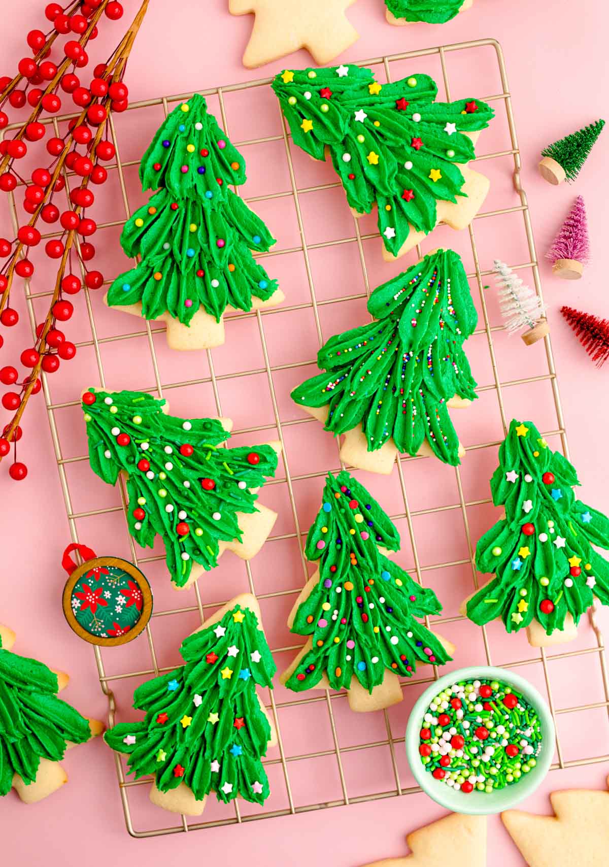 plate full of Christmas tree cookies with sprinkles