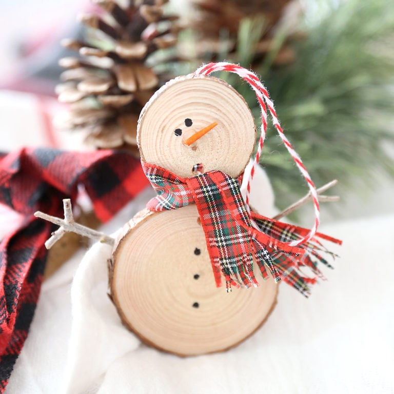 snowman ornament made out of wood slices